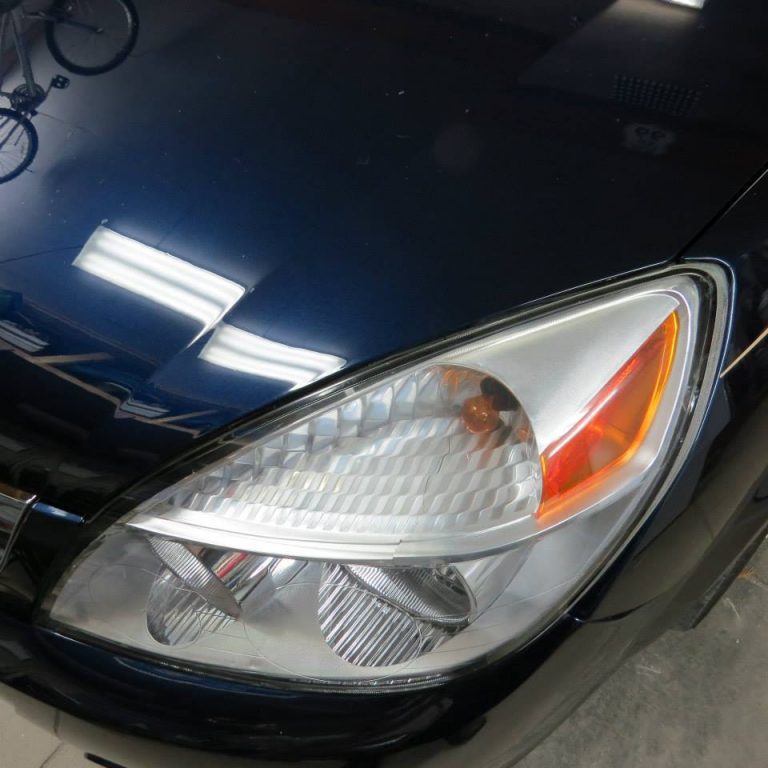 zoomed in headlight of a car