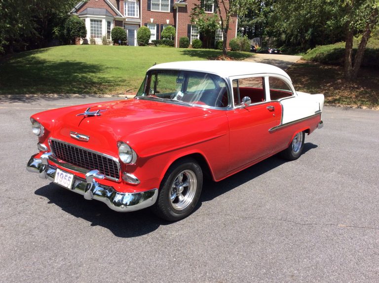red and white chevrolet bel air